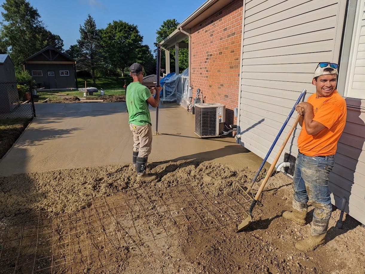 Exposed aggregate concrete patio with river stone finish in London, Ontario