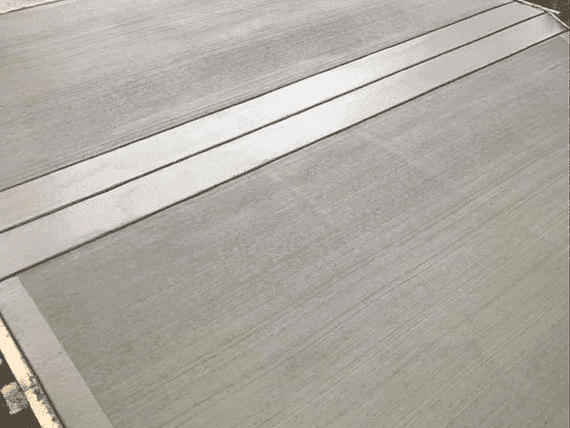 Broom finish concrete driveway installed in London, Ontario by London Concrete Forming