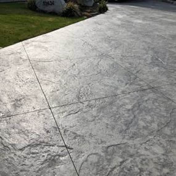 Stamped concrete patio with cobblestone pattern installed in London, Ontario